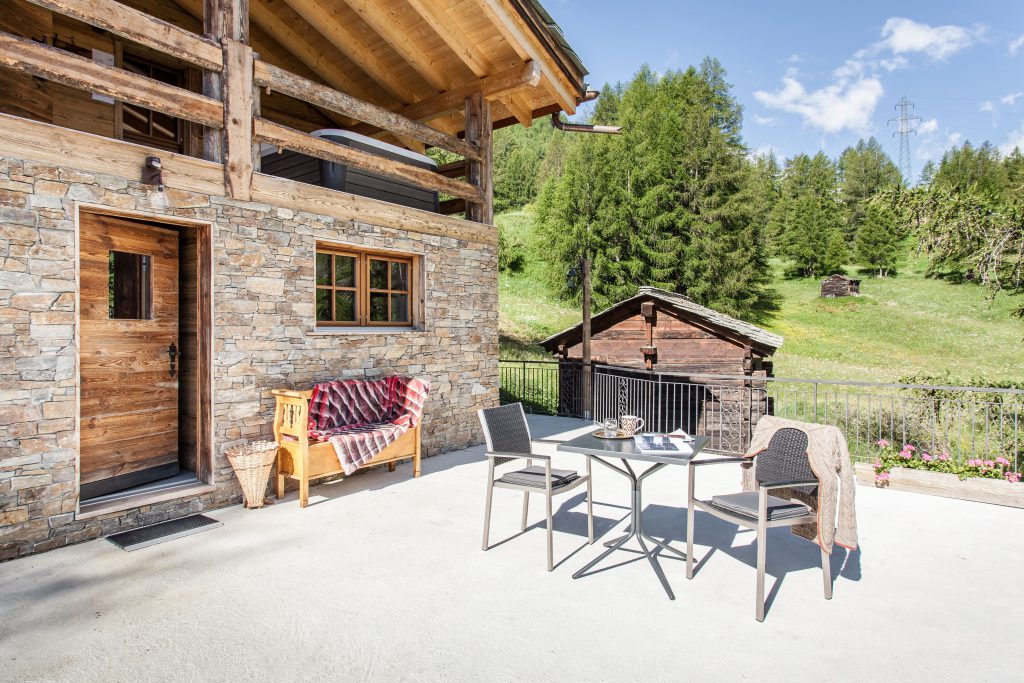 Terrace of Mountain Chalet 4 You with seating and mountain view