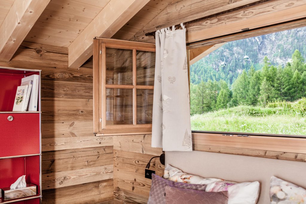 Bedroom with corner window and view at Mountain Chalet 4 You